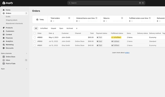 Shopify admin orders page displaying a list of customer orders with payment status, fulfillment status, and delivery details.
