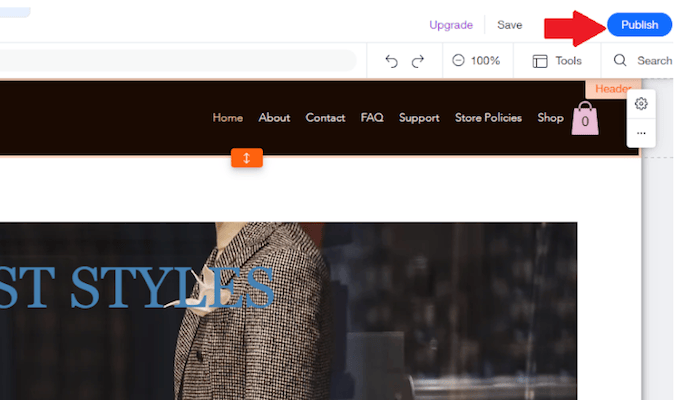 Screenshot of Wix website builder with red arrow pointing to publish button in the top right corner.