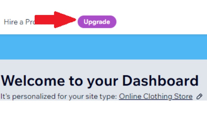 Screenshot of Wix website builder with red arrow pointing to upgrade your subscription button.